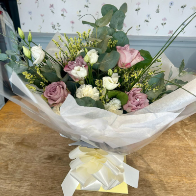 Evelyn - A fabulous collection of white and cream flowers make this the perfect gift. This bouquet will be hand delivered by the local florist.